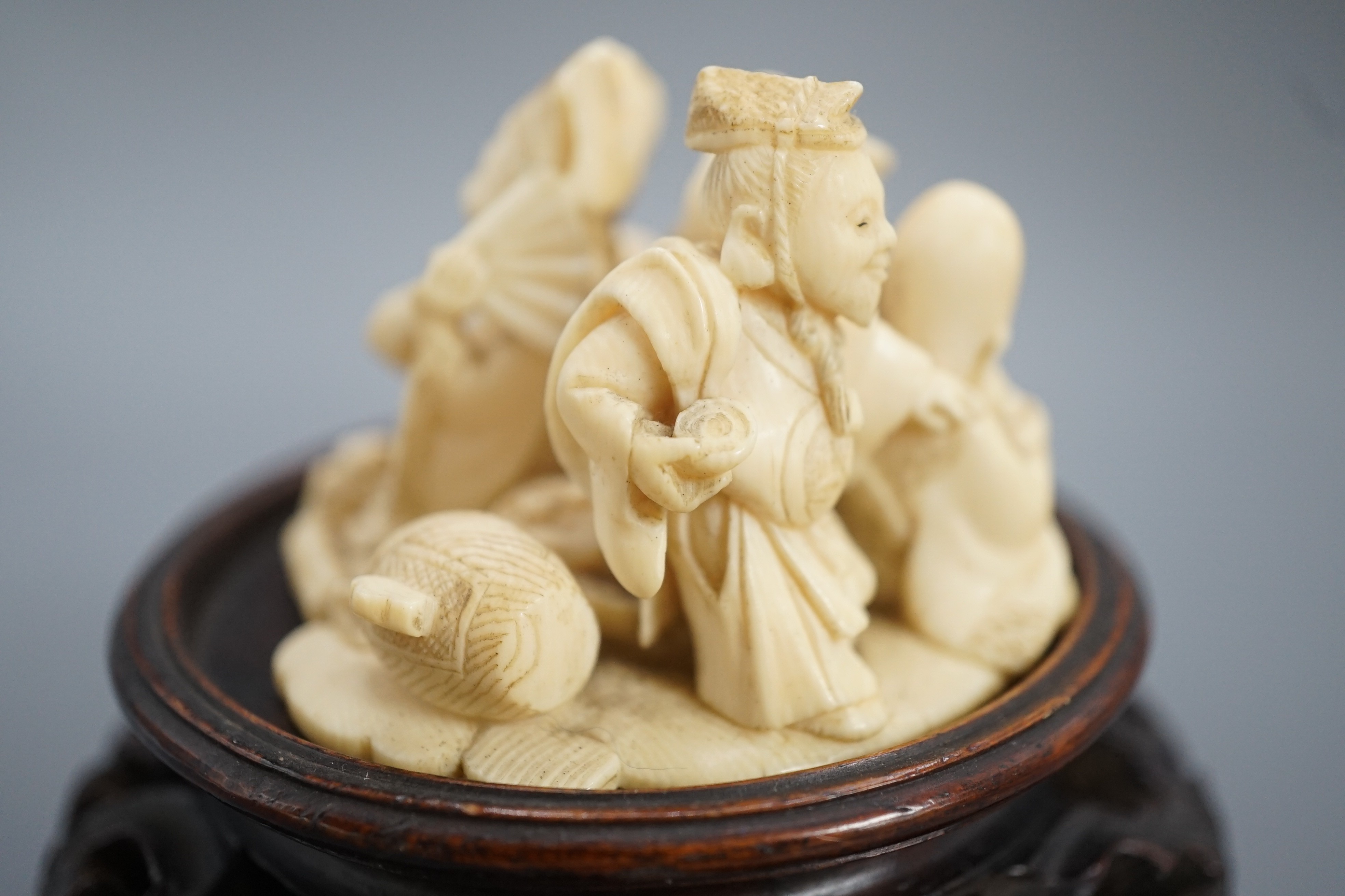 A Japanese ivory okimono of four of the Gods of Happiness, signed Gyokuzan, early 20th century, 6cm